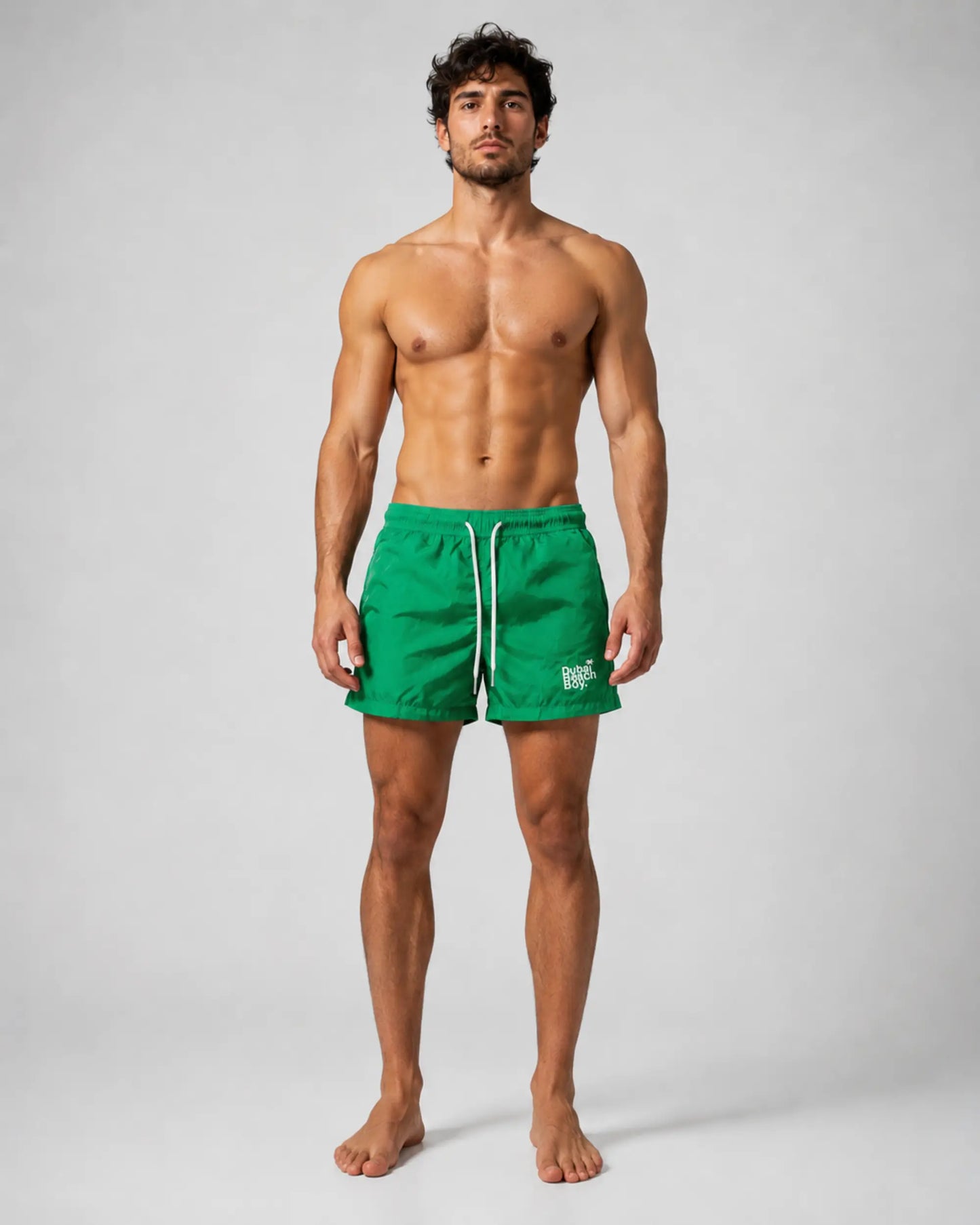 Dubai Beach Boy emerald green swim shorts front model pose